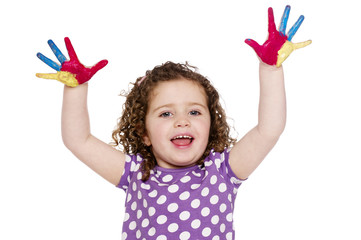 Young girl with painted fingers isolated on a white background