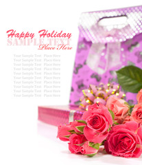 bouquet of roses and a gift box for the holiday