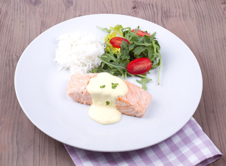 Salmon with hollandaise sauce and rice
