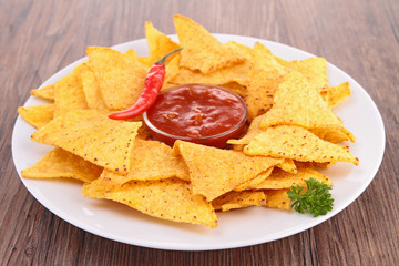 corn tortilla chips with spicy sauce