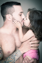 Father and daughter,  man with tattoo
