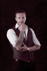 man with stylish suit and tattoos
