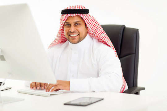modern arabic businessman using computer