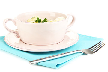 Tender young potatoes with sour cream and herbs in pan isolated