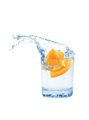 Orange in glass isolated on white background