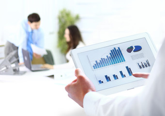 busienssman holding digital tablet in office