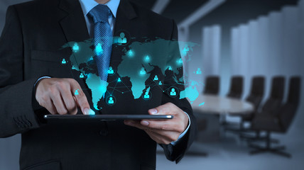 businessman using tablet computer shows internet and social netw