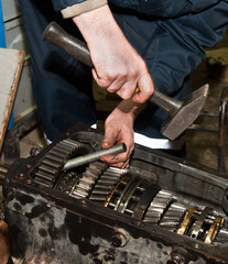 worker repairs transmission