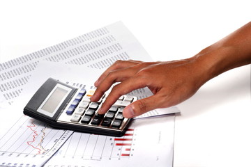 Human hands working on calculator on white