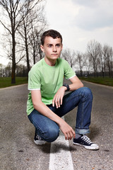 Young boy posing outdoors