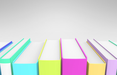 A row of very colorful books on a grey background.