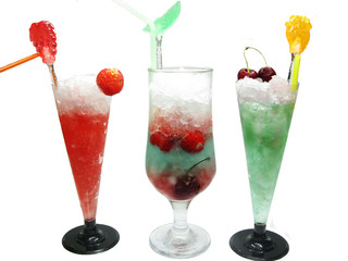 three alcohol liquer cocktail drinks with fruit