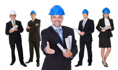 Portrait of happy architect and his team