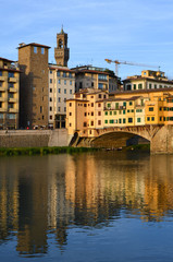 Fototapeta na wymiar Colorful view of Ponte Vecchio and Palazzo Vecchio