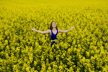 Fototapeta premium beautyful teen model in canola field