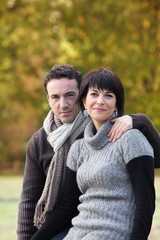 Fototapeta premium Portrait of a couple strolling in a public park