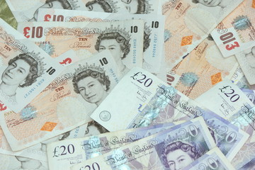 A pile of english £10 and £20 notes