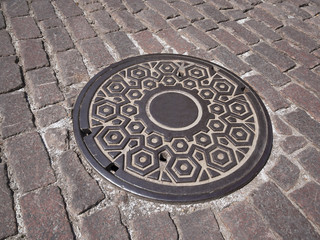Manhole cover on old  street