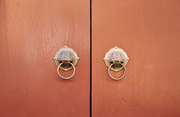 Chinese traditional door with lion knocker, Phuket Thailand.