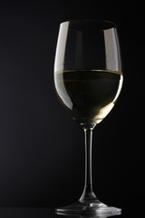 white wine glass silhouette black background