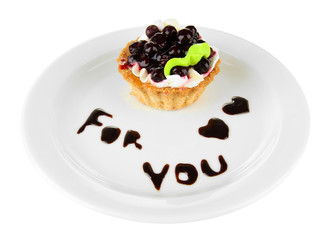Sweet cake with blackberry and chocolate sauce