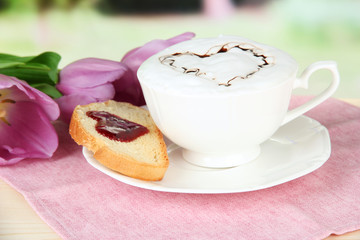 Composition of coffee, toast and tulips on bright background