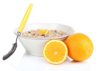 Useful oatmeal in bowl with fruit isolated on white