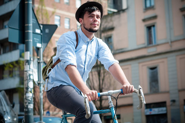 Fototapeta na wymiar hipster young man on bike