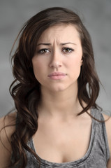 Fototapeta premium Beautiful Young Caucasian Woman Looking Worried