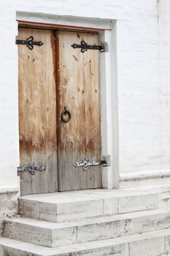 old traditional porch with wooden door