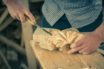 Carpenter working with chisel