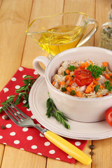Delicious rice with vegetables and herbs in pot