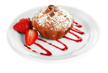 Tasty muffin cake with strawberries and chocolate
