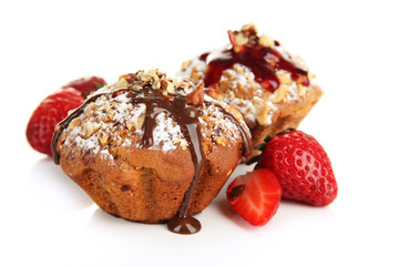 Tasty muffin cakes with strawberries and chocolate, isolated