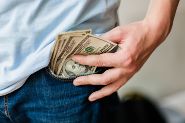 Man holding American dollars in  hands