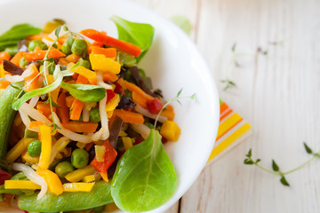 Roasted vegetable mix in a white bowl