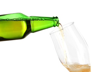 Beer poured into glass isolated on white
