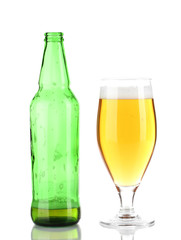 Glass of beer with bottle isolated on white