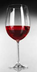 Glass of wine on grey background