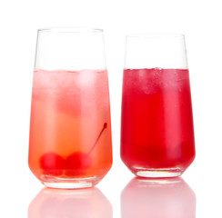 Two cherry cocktails with ice isolated on white