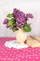 Composition with lilacs on bright background