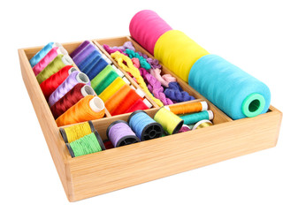 Fototapeta na wymiar Colorful threads for needlework in wooden box isolated on white