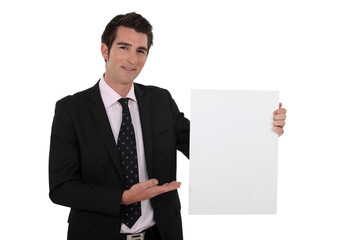 Businessman with a blank board