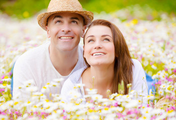 Young family on camomile glade