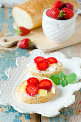 Bruschetta with cheese , honey and strawberries