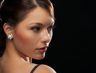 woman with diamond earrings