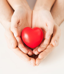 Obraz premium woman and man hands with heart