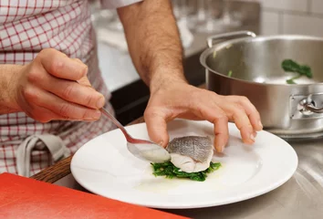 Foto op Canvas Chef is serving boiled seabass © Kondor83