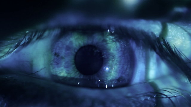 Macro video of a human eye with binary code projections