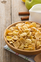 bowl of corn flakes  on wood